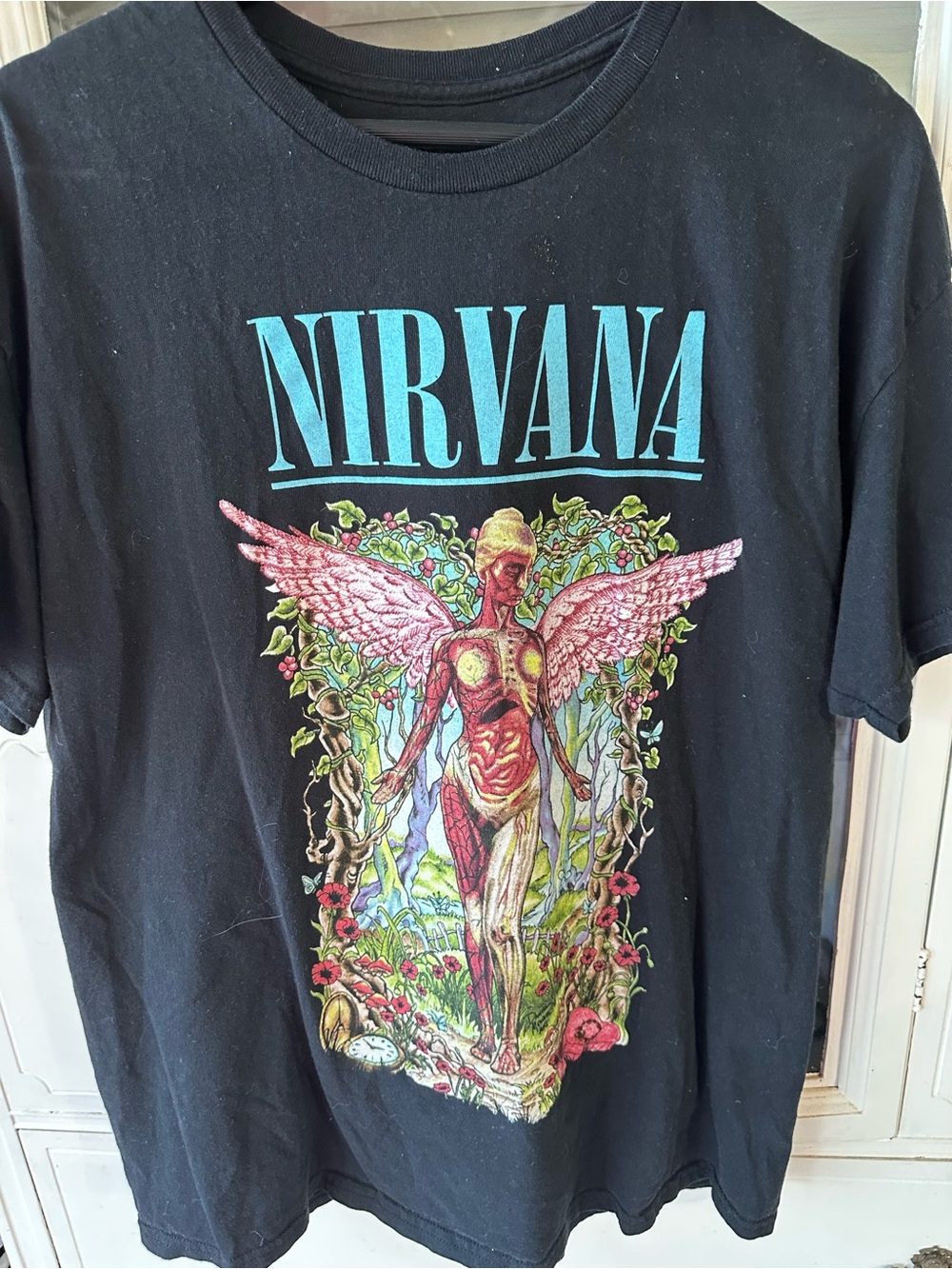 NIRVANA Black Tee with Turquoise Logo and Pink Angel Graphic